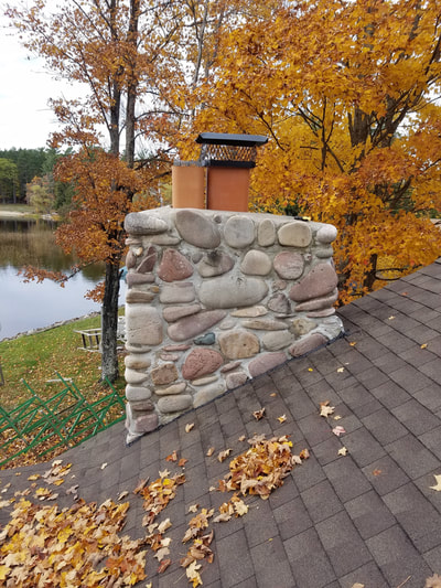 roof with leaves and stone chimney